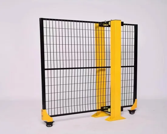 Safety barrier separating robots from workers.